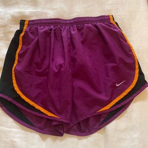 Purple Nike track shorts